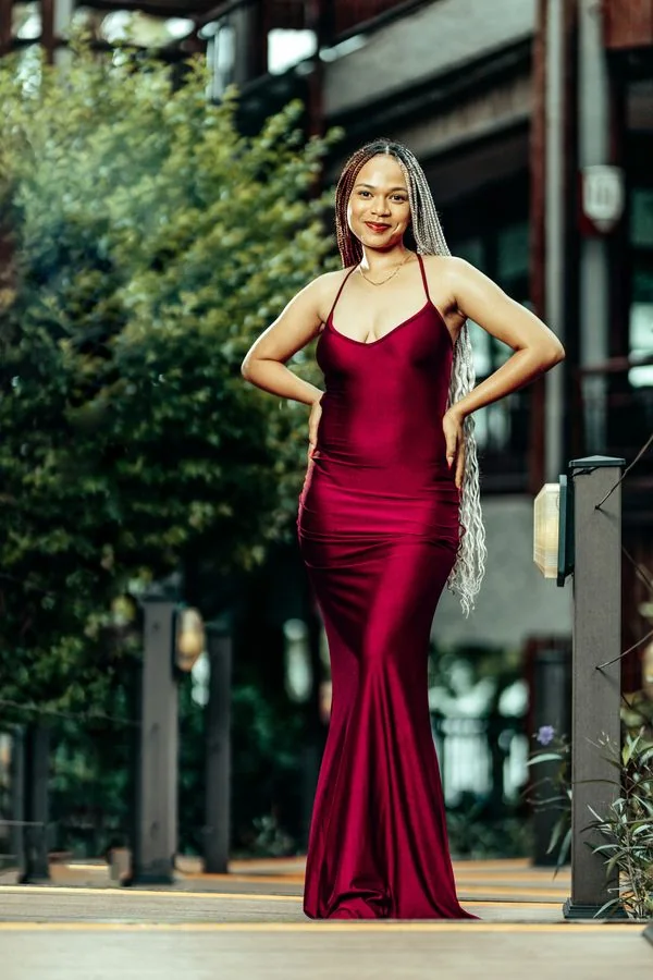 Burgundy satin wrap dress with draped V-neckline on a model