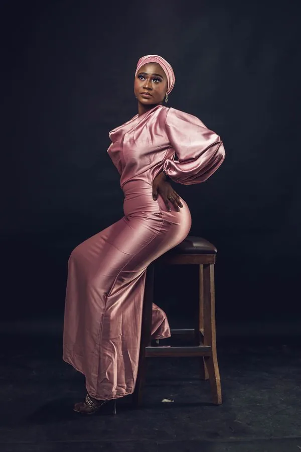 Dusty rose satin gown with soft glossy folds