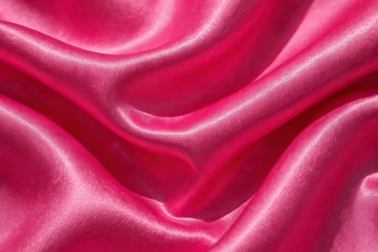 Hot pink satin weave close-up with glossy shine