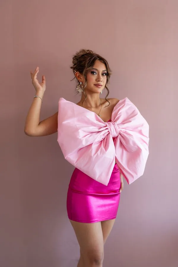 Hot pink satin mini dress with oversized satin bow