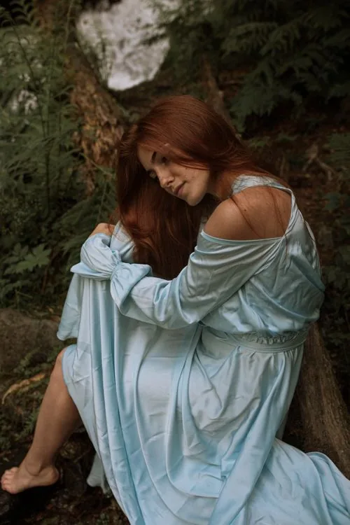 Light blue satin maxi dress in natural daylight outdoors