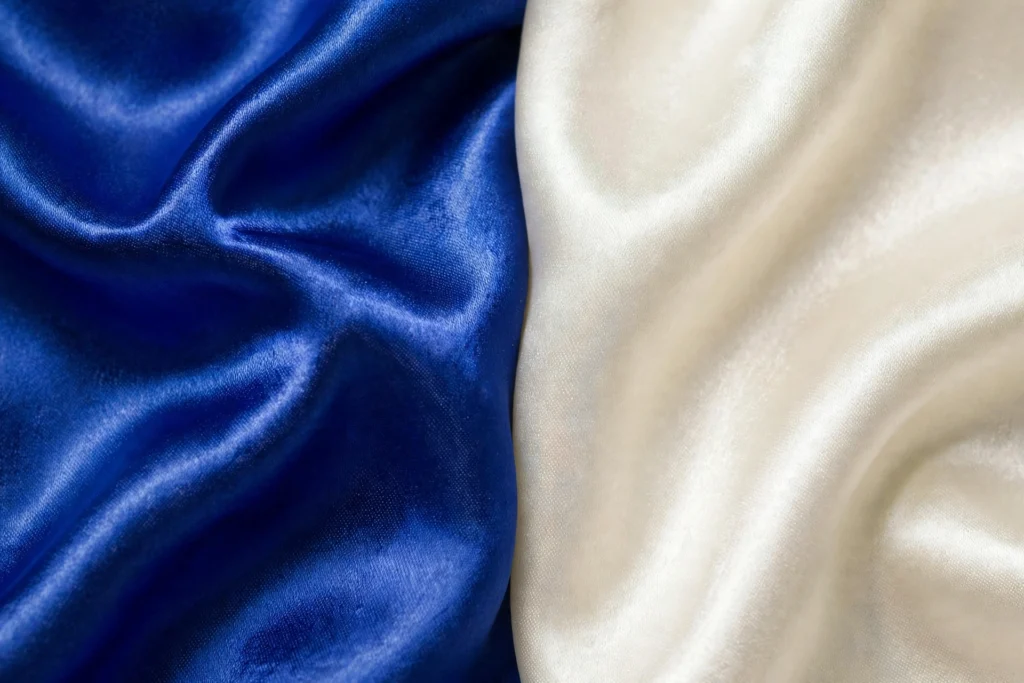 Royal blue satin fabric surface close-up