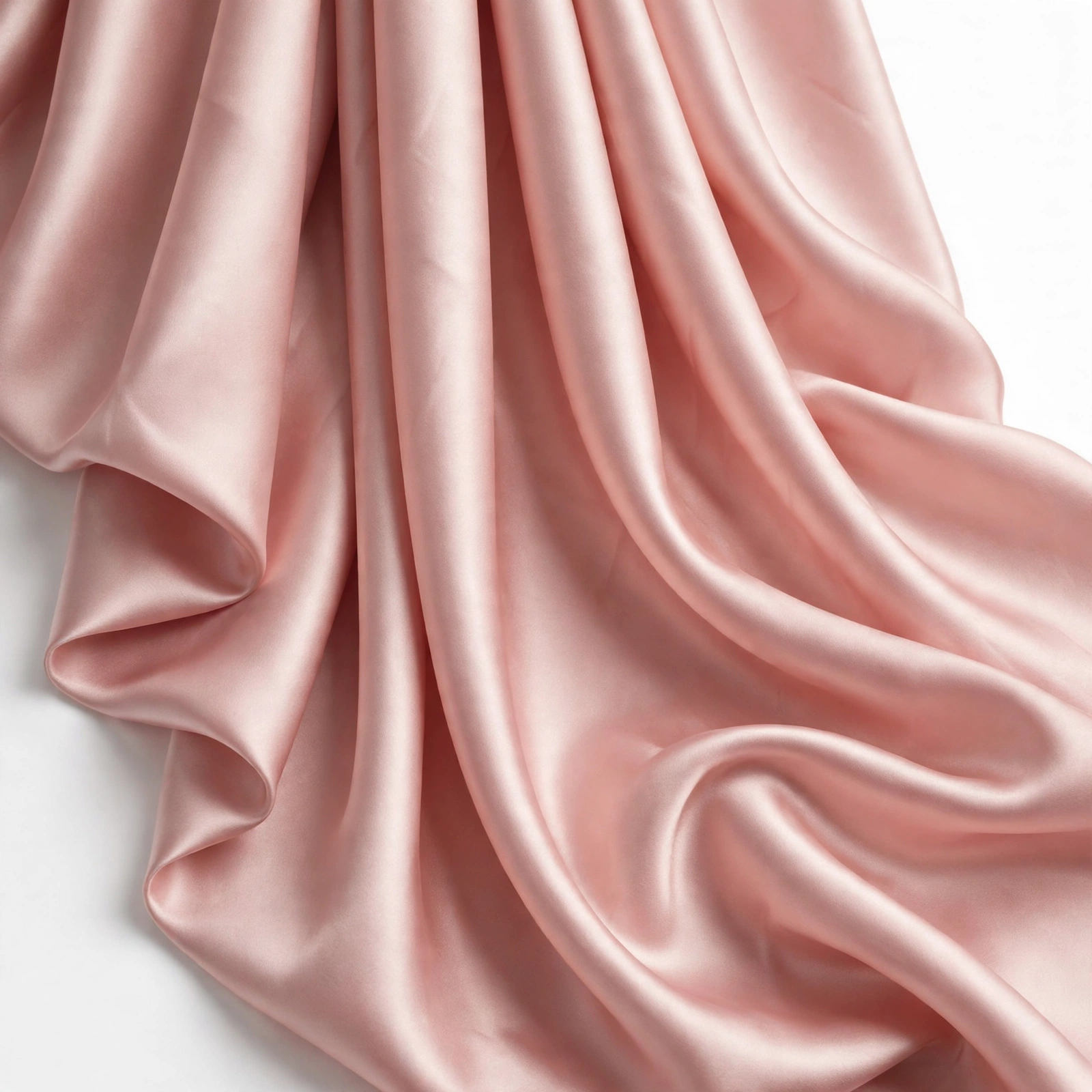 Blush pink silk satin fabric draped in glossy soft folds